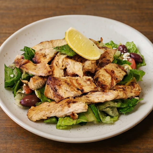 Grilled or Cajun Chicken Over Greek, Caesar or Leaf Salad.
